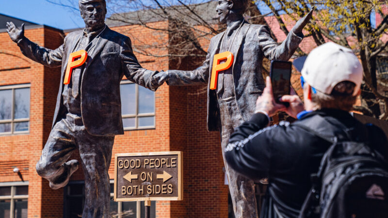 Sculpture of the president and Jeffrey Epstein appears briefly on the Downtown Mall