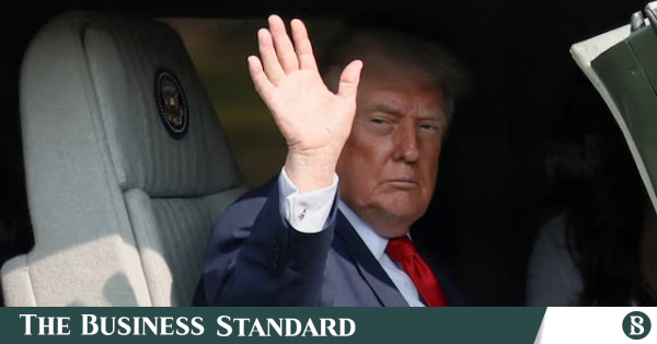 Awkward moment as Trump congratulates reporters he is suing